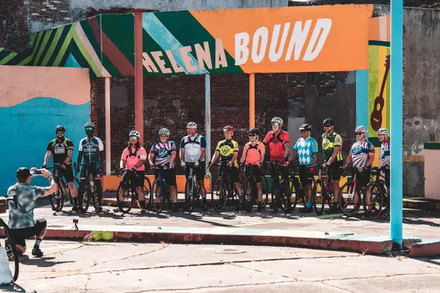Cyclists gathered at Helena Bound mural for studioDRIFT event